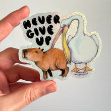 Load image into Gallery viewer, Never Give Up Capybara Pelican Holographic Glitter Vinyl Die Cut Durable Sticker