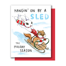Load image into Gallery viewer, Hanging On By A Sled Winter Sledding Holiday Card