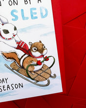 Load image into Gallery viewer, Hanging On By A Sled Winter Sledding Holiday Card